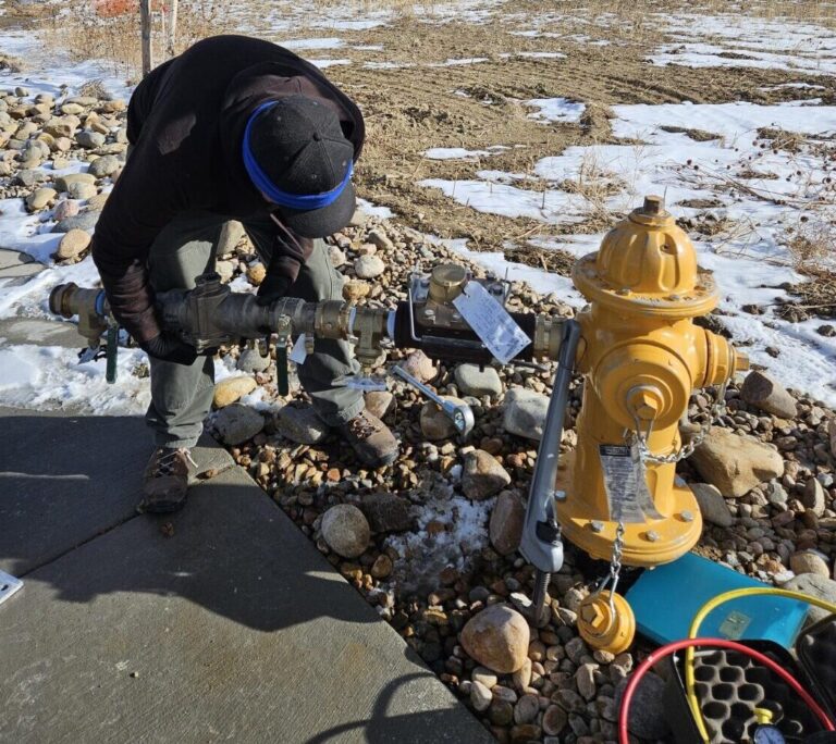 technician installing hydrant meter